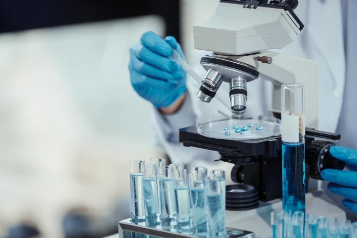 Laboratory research under a microscope